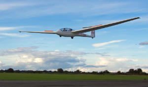 K21 landing on a gliding course at cotswolds gliding club