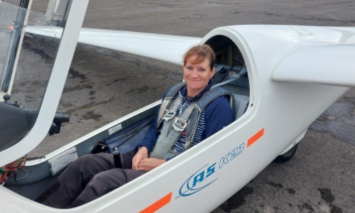 Female gliding student learning to fly a K21 at Cotswold Gliding Club